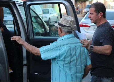 Proprietário sendo conduzido ao Greco 